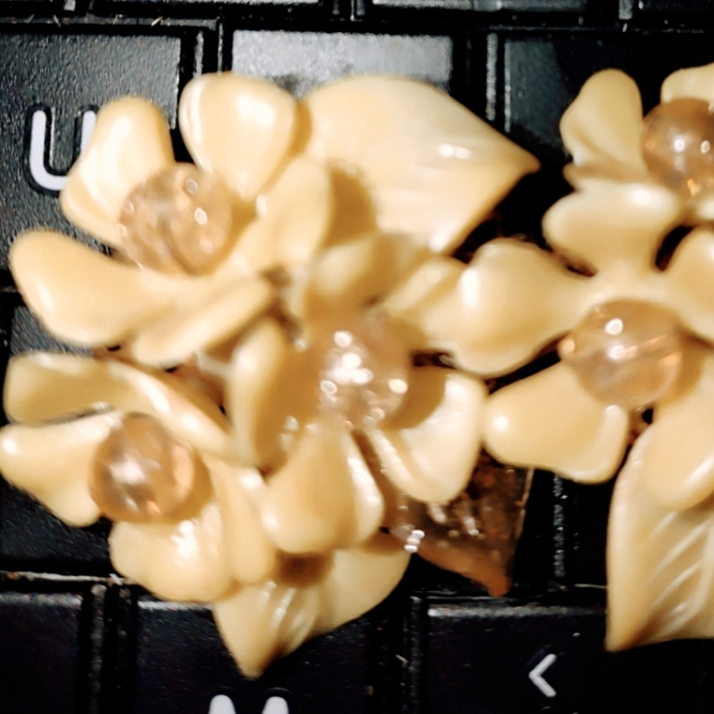 Gorgeous 1940s celluloid clip-on earrings of a beautiful floral flower